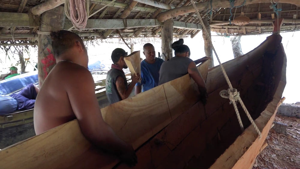 Micronesian men boatbuilding