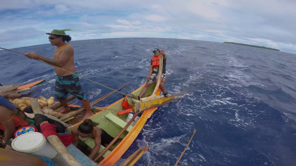 Micronesian traditional navigator and team working the open ocean