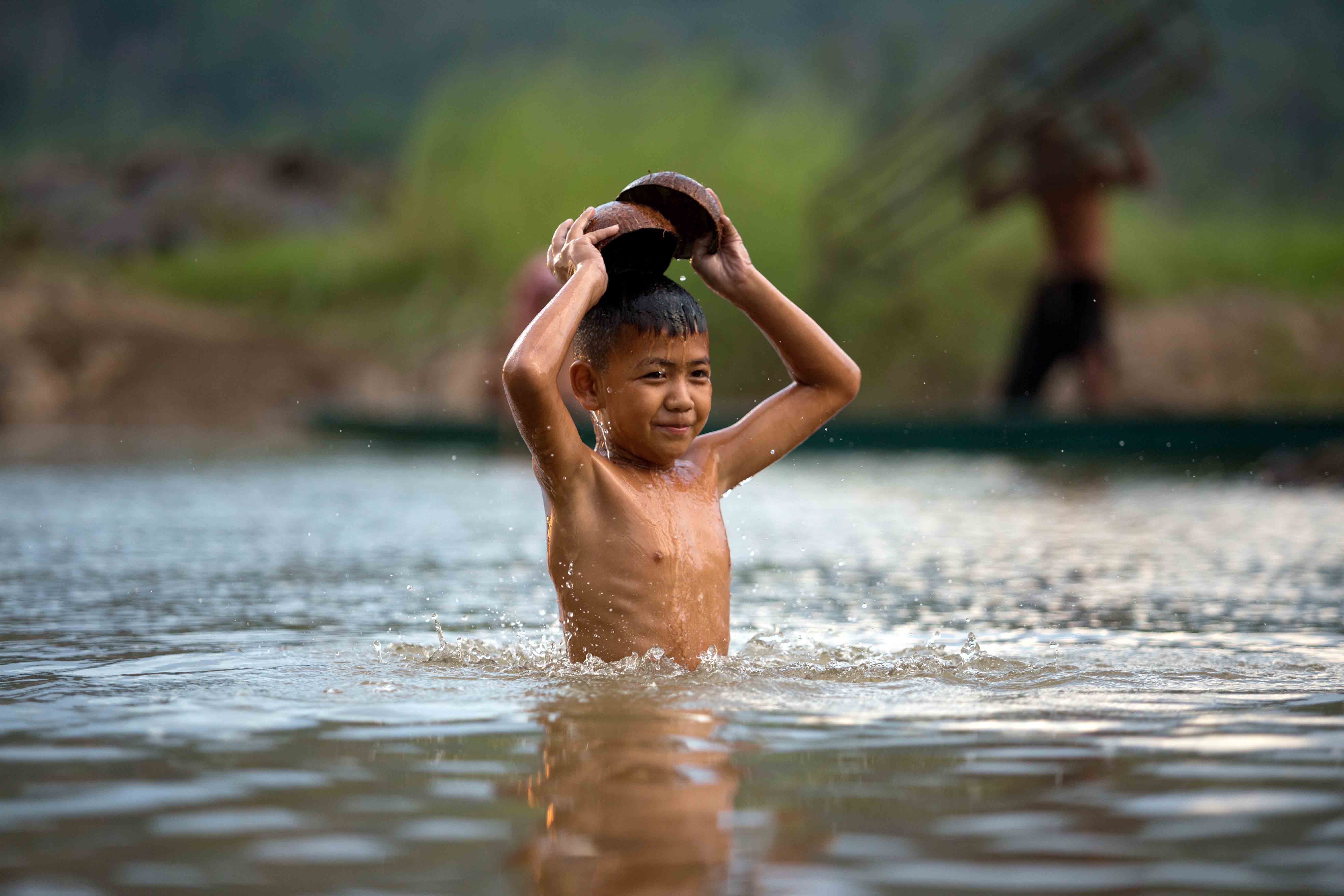 boy in Mekong river