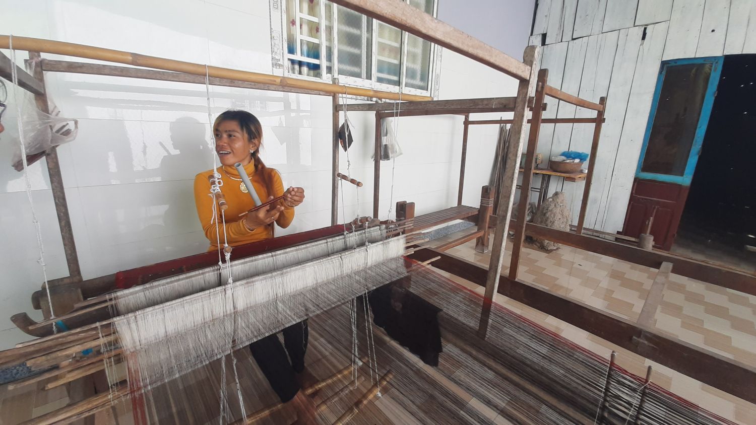 A local women was weaving silk at Van Giao craft village in Tinh Bien, An Giang Province
