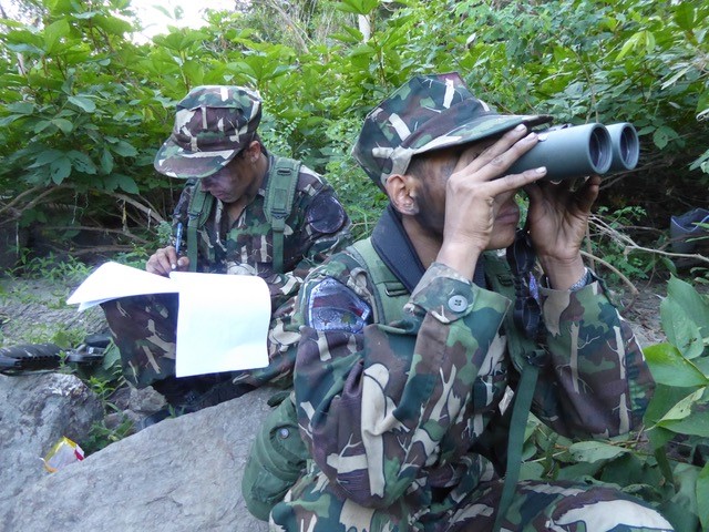 Two rangers on the lookout in Myanmar