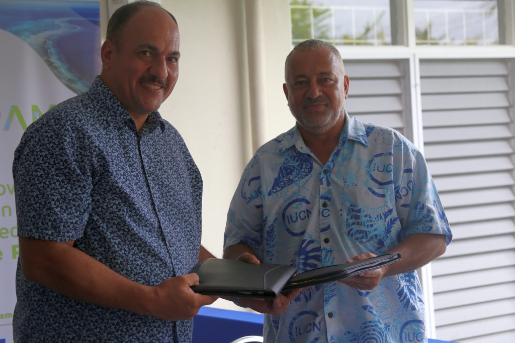 Chair of NTF Board of Trustees Craig Powell and IUCN Oceania Regional Director Mason Smith exchange the grant agreement
