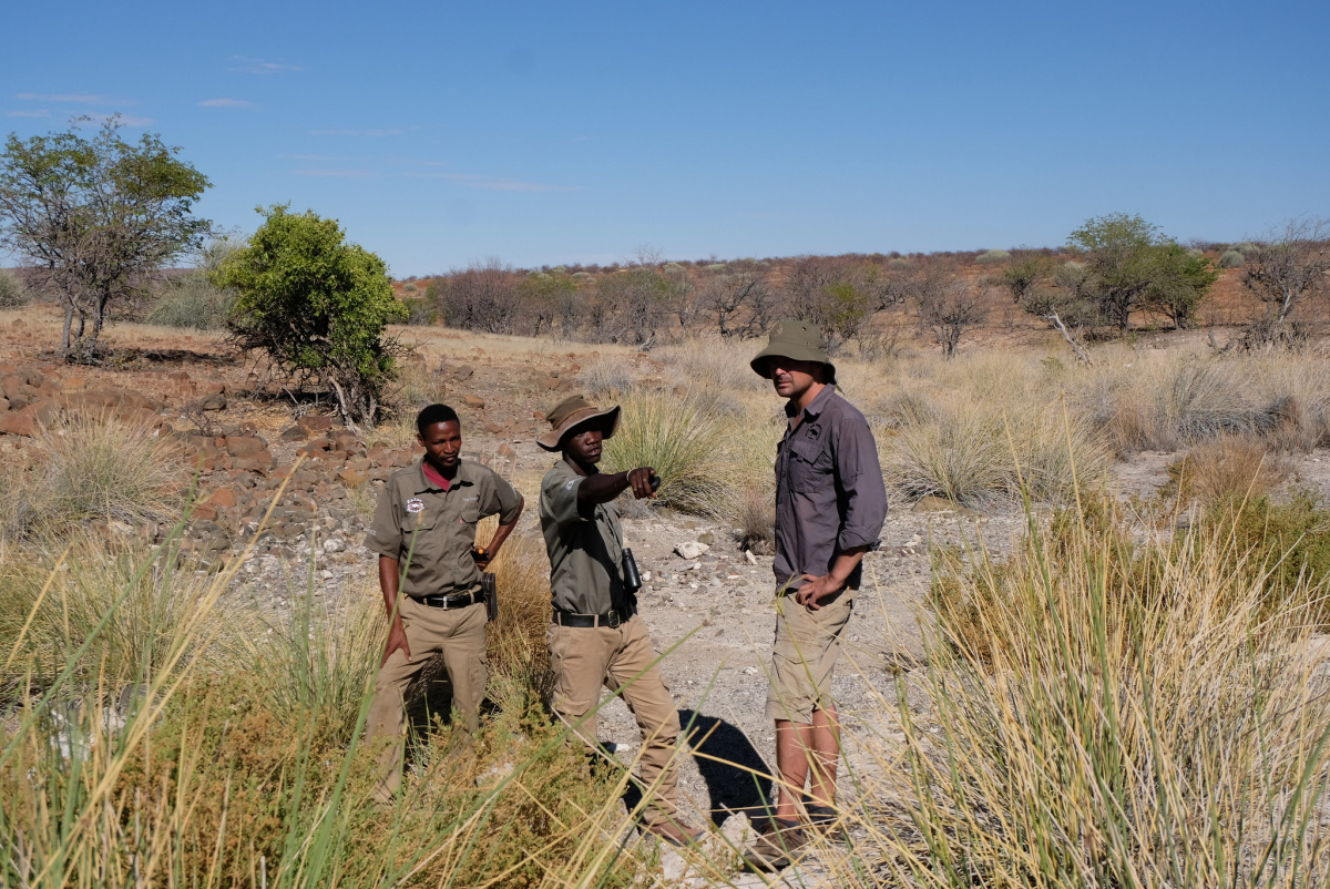 Rhino rangers in Namibia discussing the rehabilitation of a spring