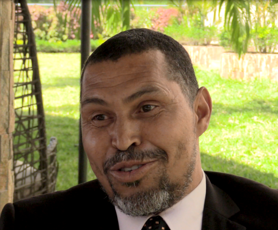 Man in suit talking to camera