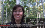 woman talking to video camera with woods behind
