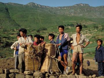 Men in the Huanggoushu Waterfall region, China