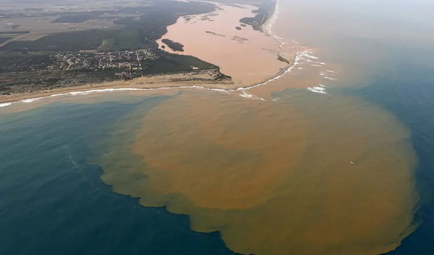 The Rio Doce emptying into the Atlantic two weeks after the dam collapse.