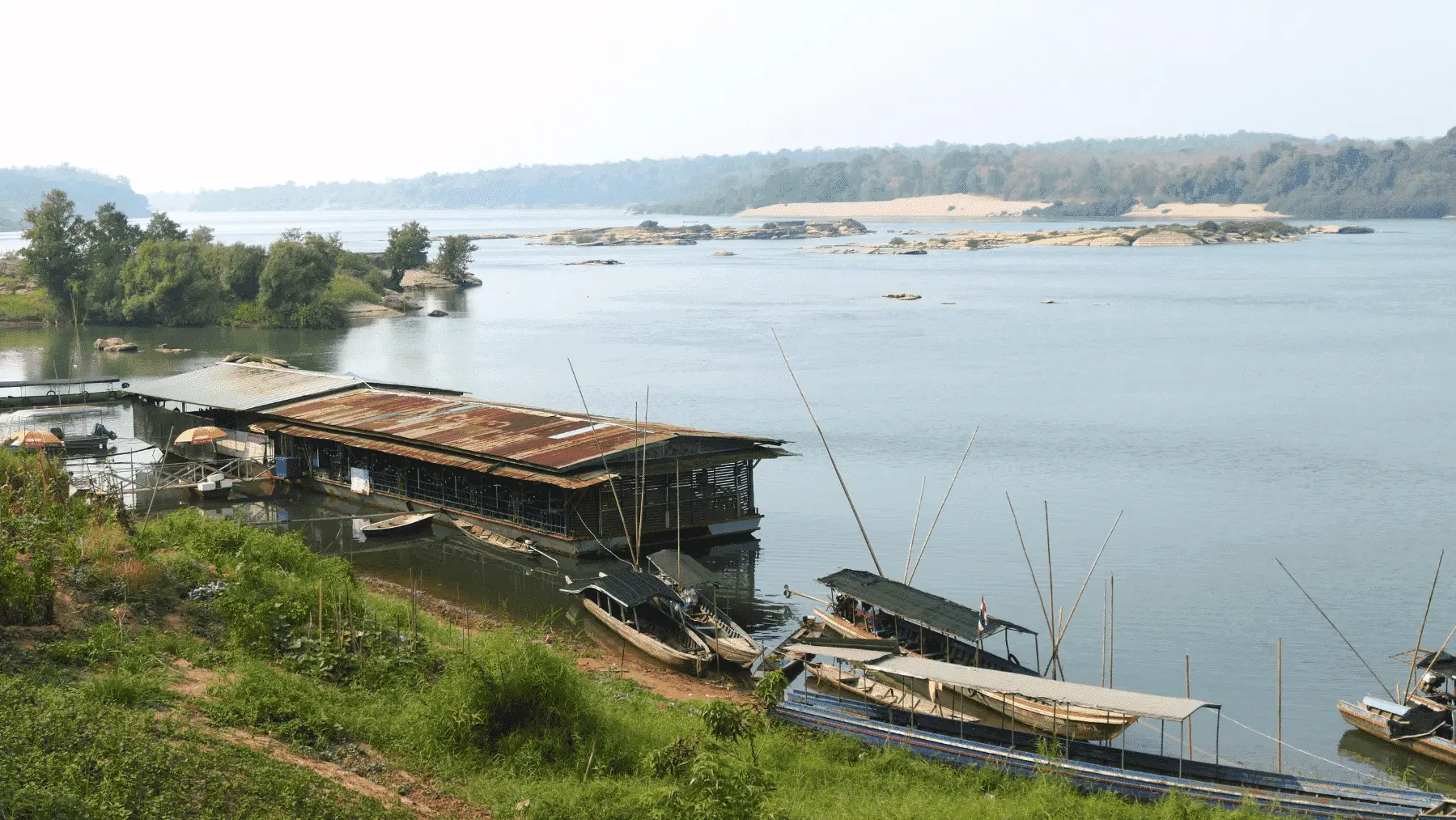 Fishing boats docked around a restaurant on the River Mun, Ubon Ratchatani 