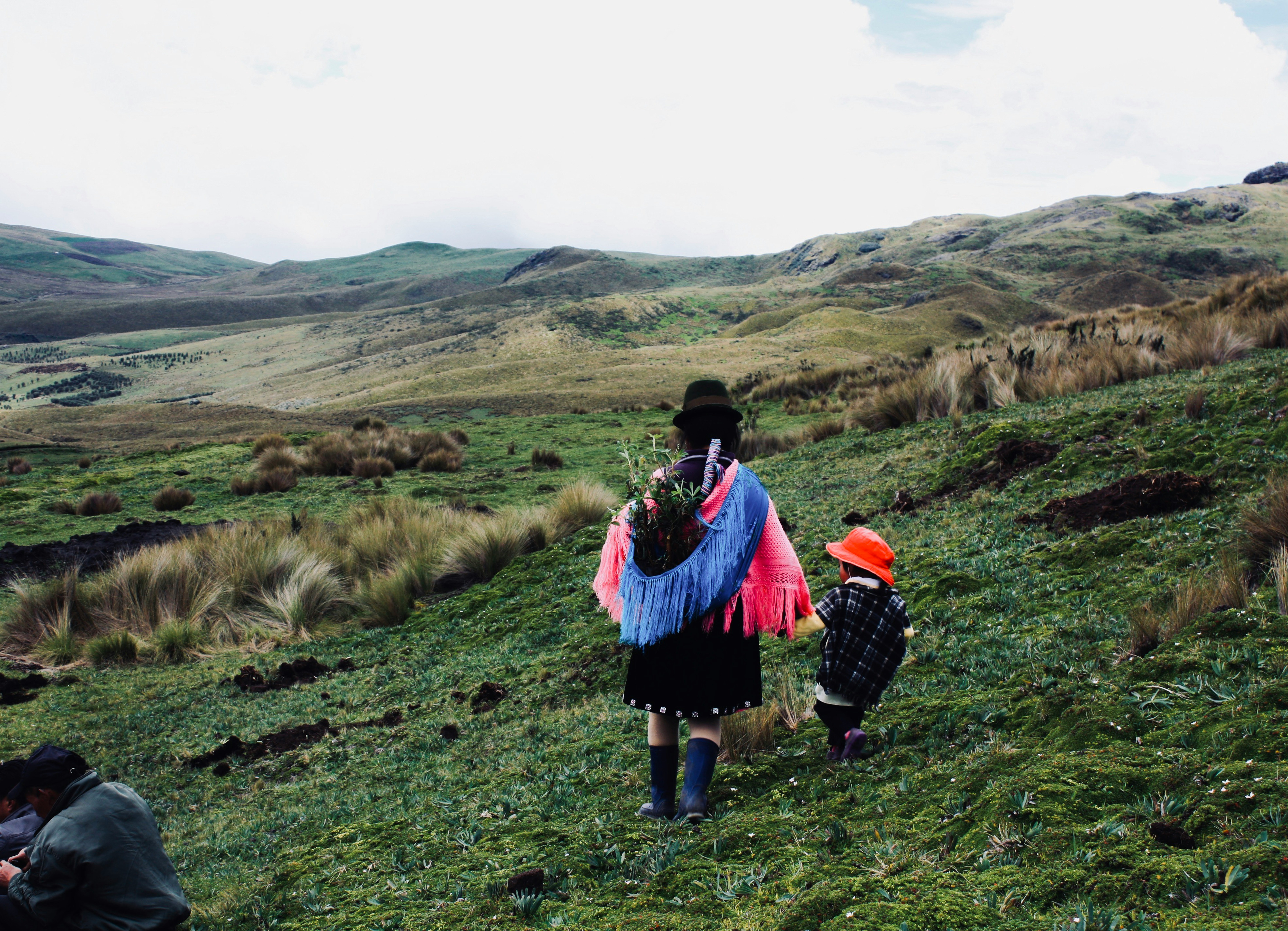 Guangaje, Ecuador: After the blessing of a water spring. A mother with a child returns home.