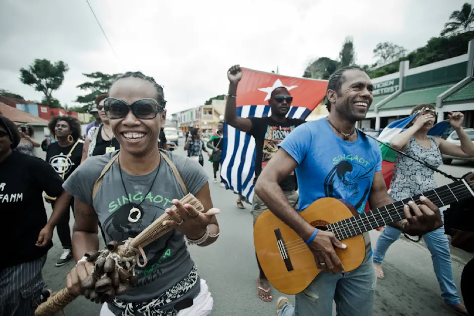 Delly Roy (L) and David Nalo (R) leading the Singaot Musik Kamp parade with cultural creatives from around the Pacific and Indian Oceans through the streets of Port Vila.