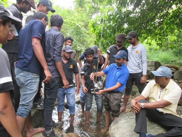 Prof. M.I.M. Mowjood demonstrating stream flow measurement to the students