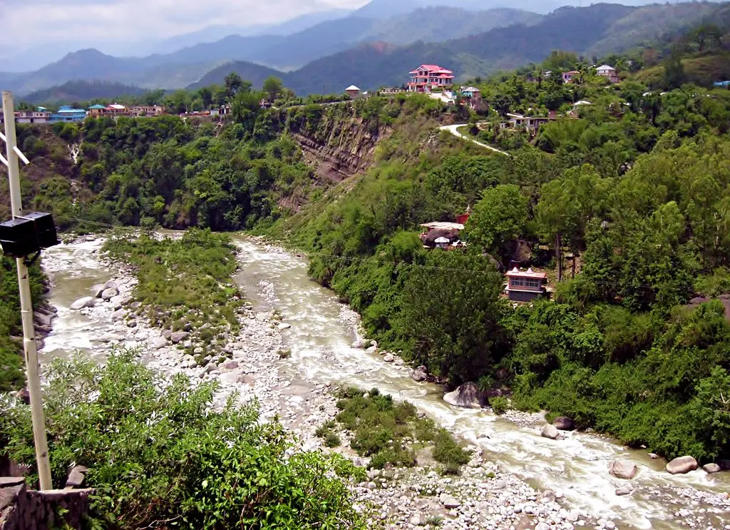 River flowing near temple on hill