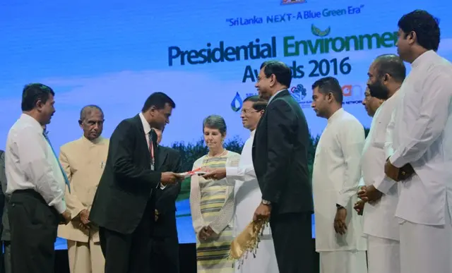 The Conservator General of Forests accepting the certificate from the President of Sri Lanka