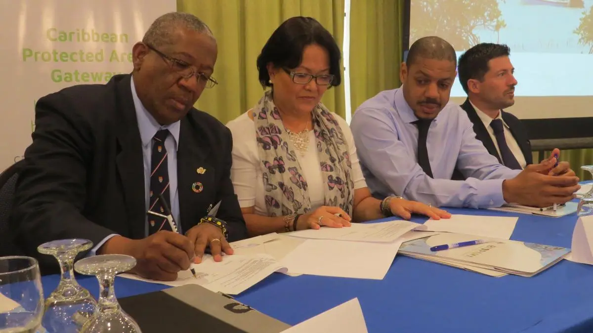 from left to right Professor Dale Webber, Pro Vice-Chancellor for Graduate Studies and Research at the UWI, Ms. Viviana Sanchez, acting IUCN Regional Director for Mexico, Central America and the Caribbean, Mr. Edmund Jackson, Environment and Climate Chang