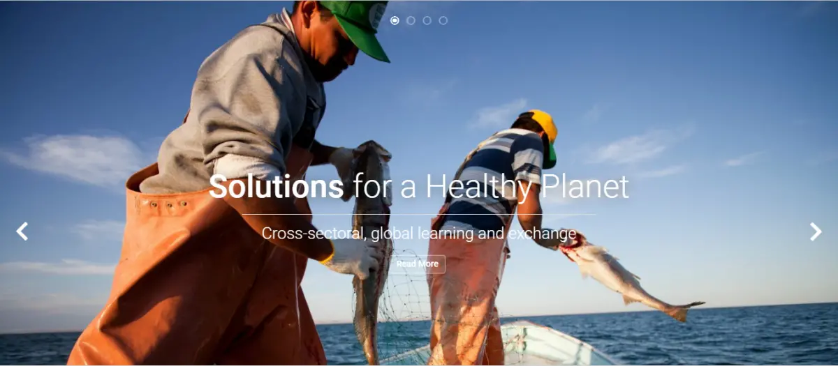 Text reads "solutions for a healthy planet" over an image of two fishermen