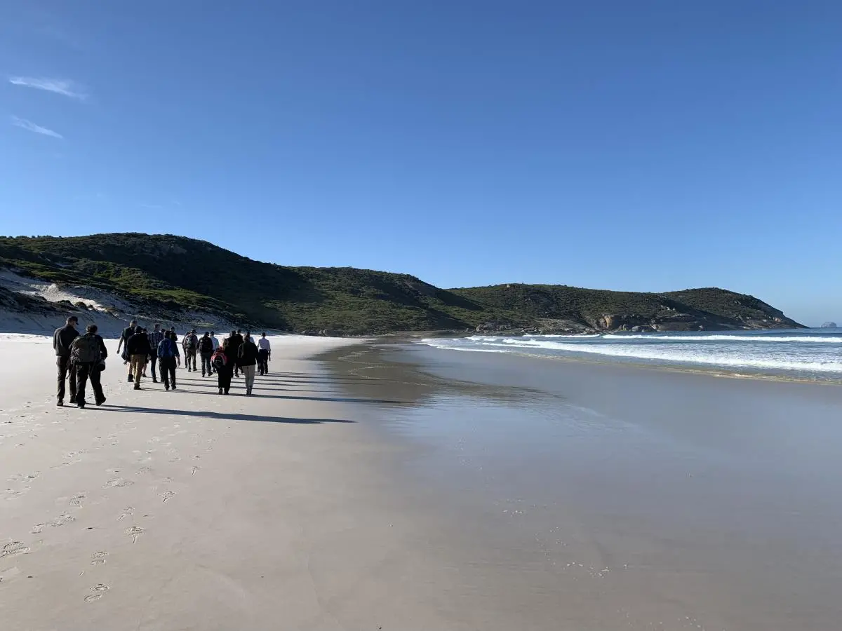 Delegates take a walk along the pristine beaches of Wilson's Promontory