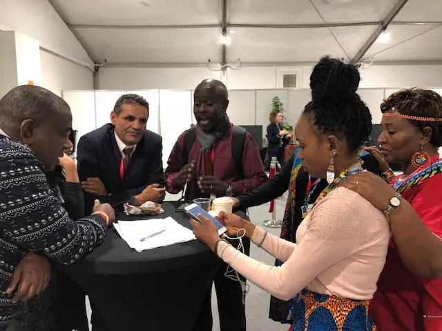 African indigenous delegates strategizing in Katowice