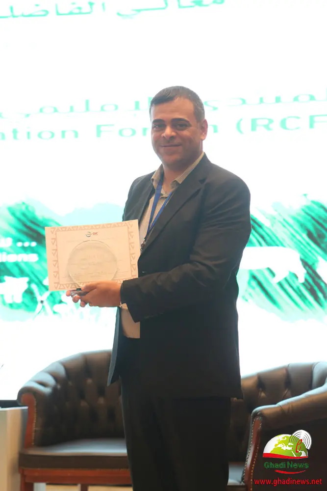 Ehab Eid holding the CEC Excellence Award 2019 trophy and certificate