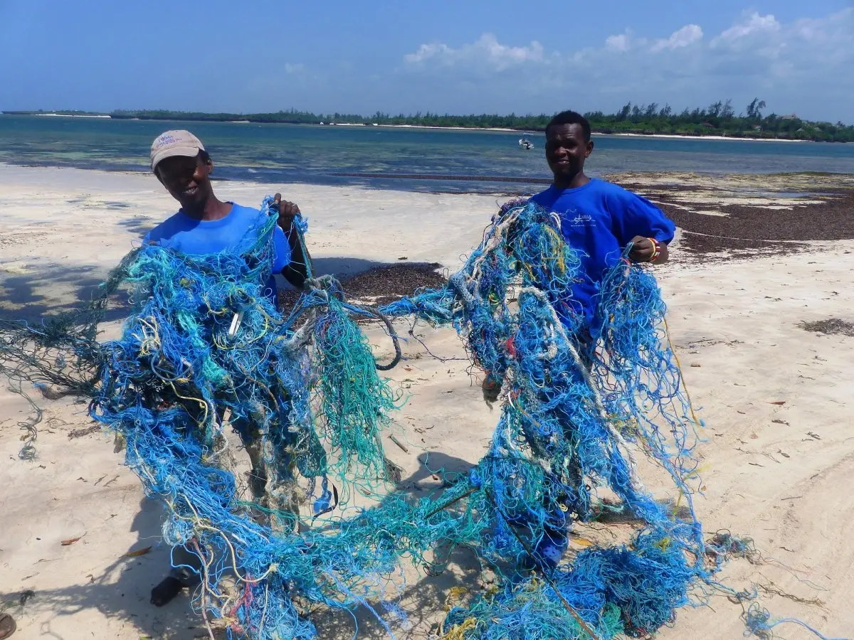 Removing discarded fishing nets from the beach 