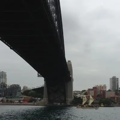The Samoan vaka, Gaualofa, sailing under the Sydney Harbour Bridge