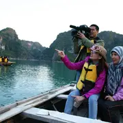 Journalists filming in Ha Long Bay